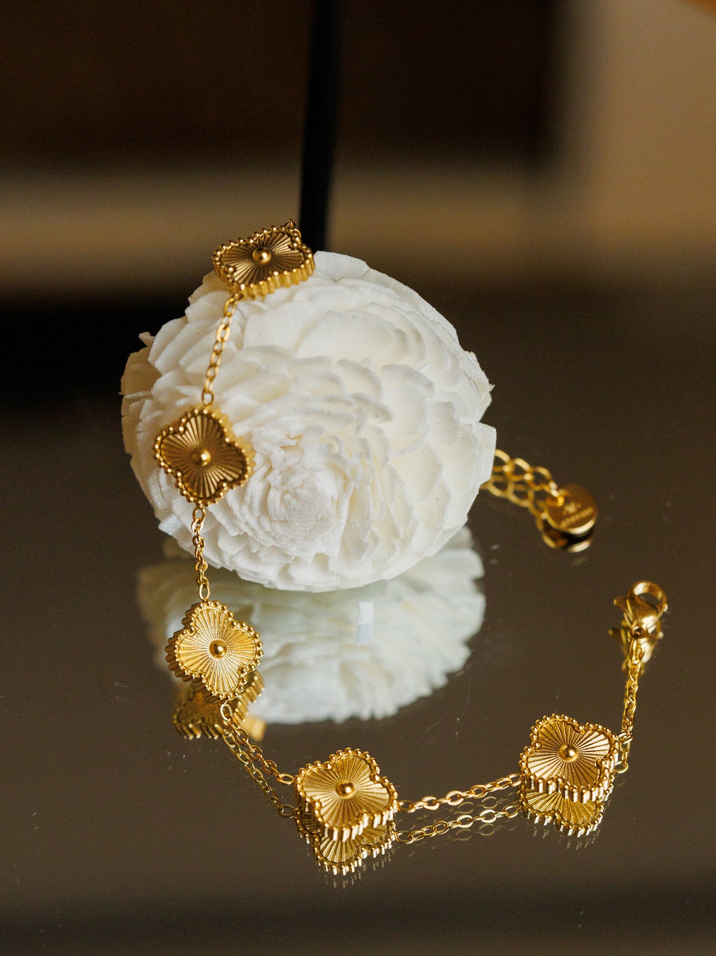 Dare to stand out with our wholesale fine four-leaf clover bracelet in stainless steel, featuring 5 lucky clovers in a bold and daring gold color!