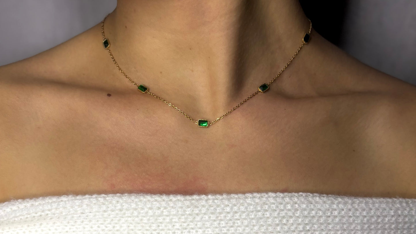 Indulge in luxury with our trendy stainless steel 18k gold plated emerald choker necklace. Made with brilliant cubic zirconia stones, this necklace exudes elegance and sophistication.