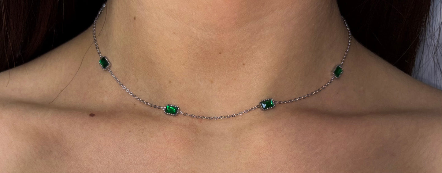 Indulge in luxury with our trendy stainless steel emerald choker necklace. Made with brilliant cubic zirconia stones, this necklace exudes elegance and sophistication.