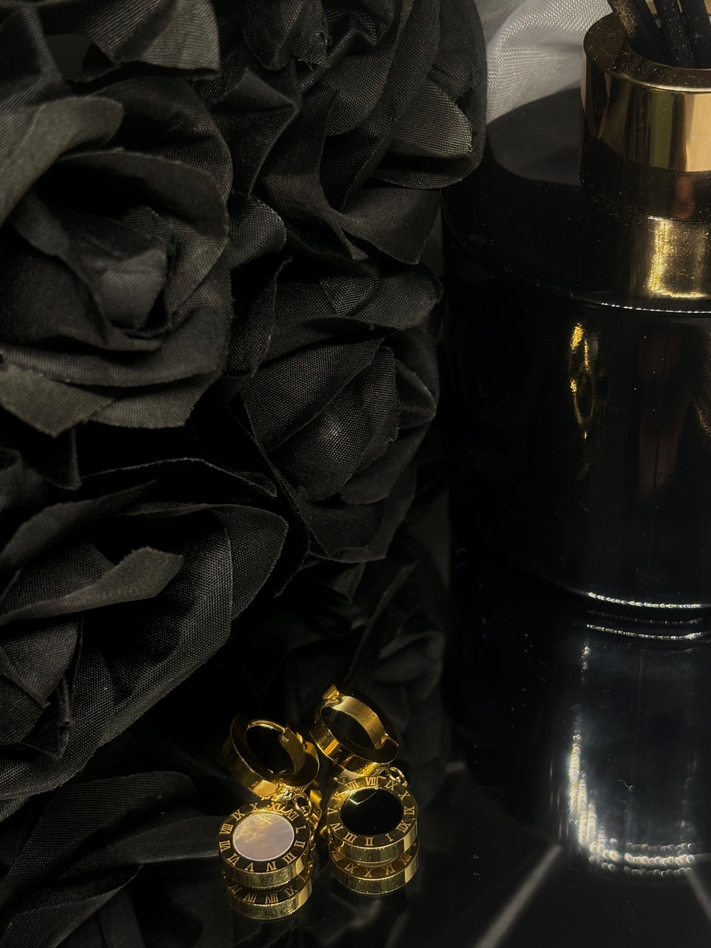 Gold-plated Roman Numeral Earrings with timeless design and elegant black and white accents, perfect for any occasion.