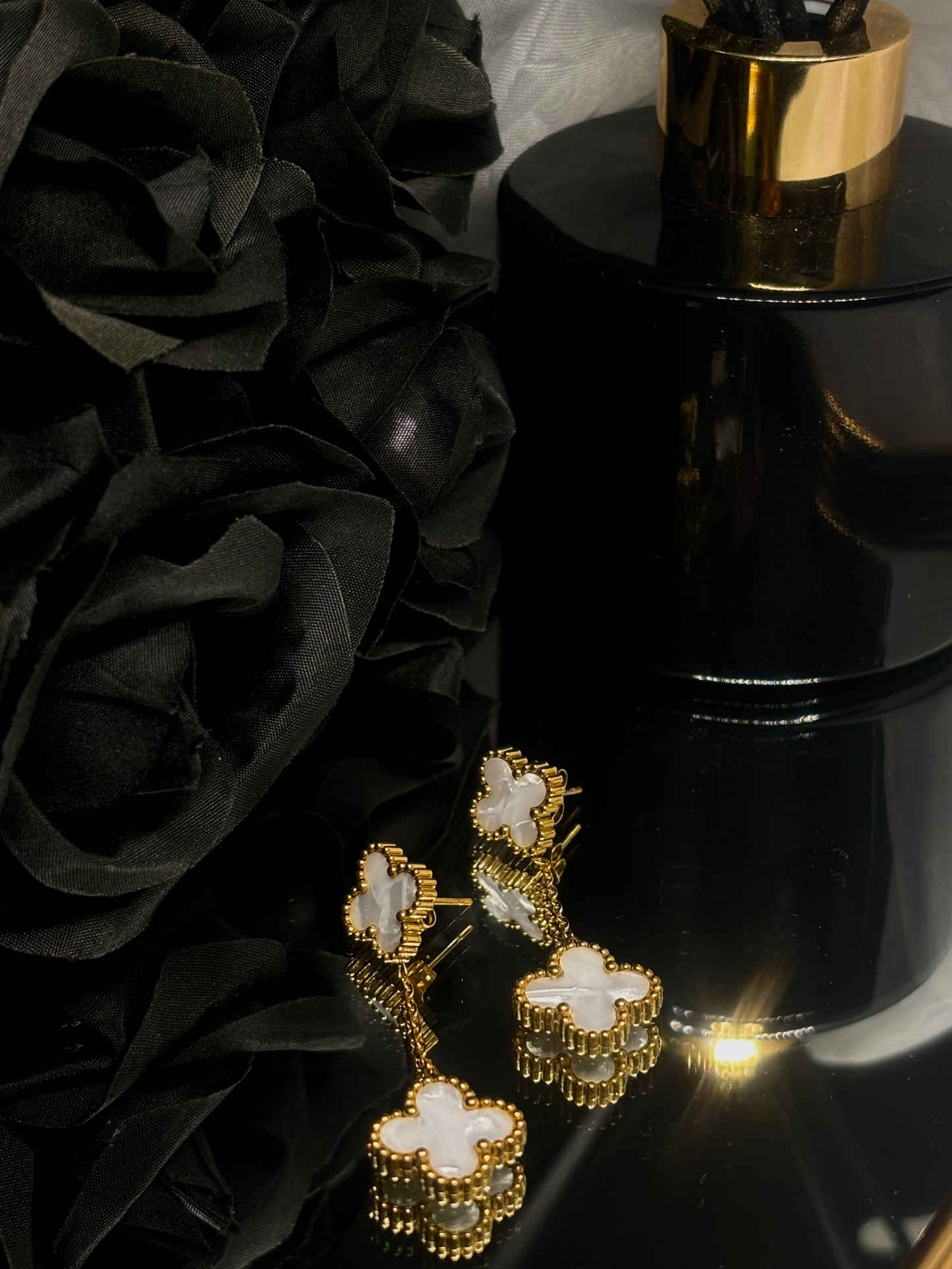 18k gold plated finish and two delicately crafted flower clovers.