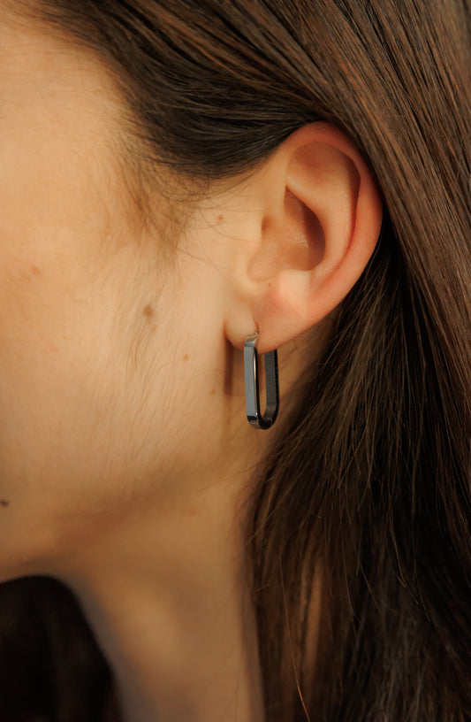 Crafted from stainless steel , these geometric oval and rectangular hoop earrings are designed to resist tarnishing for a timeless, elegant look.