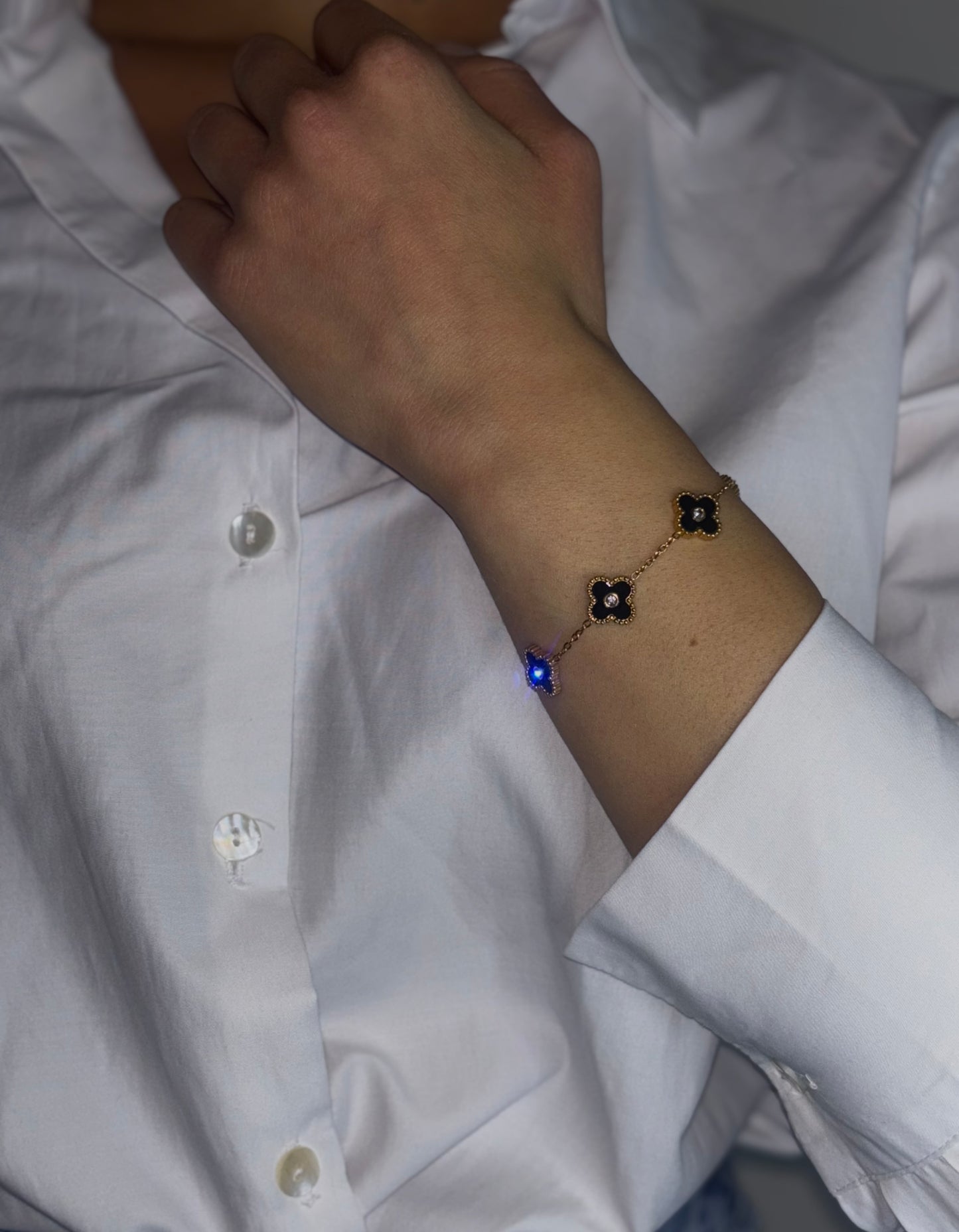 Dare to stand out with our wholesale fine four-leaf clover bracelet in stainless steel, featuring 5 lucky clovers in a bold and daring black color!