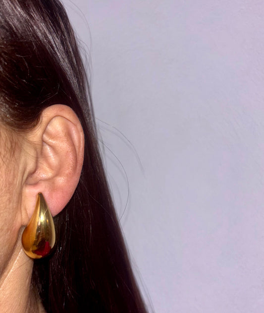 Take a risk with our waterdrop earrings! These teardrop earrings are lightweight and feature a chunky gold hollow hoop, perfect for adding a touch of adventure to any outfit. 