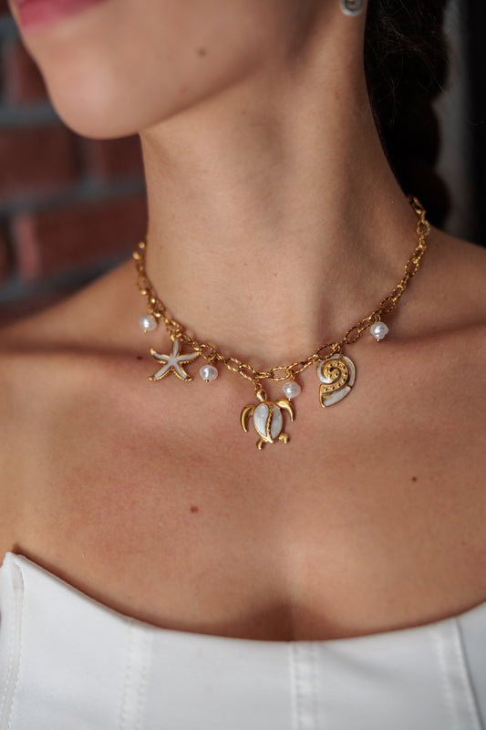 chain necklace with ocean-inspired charms