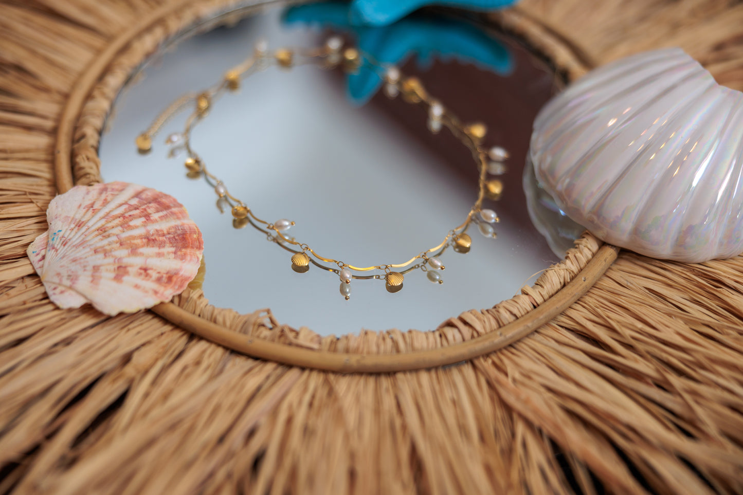 freshwater pearls and shell charms on a stainless steel chain