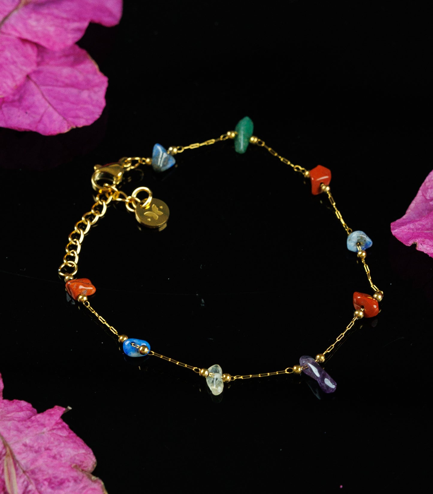 Expertly crafted with natural stone and stainless steel, this chain bracelet.