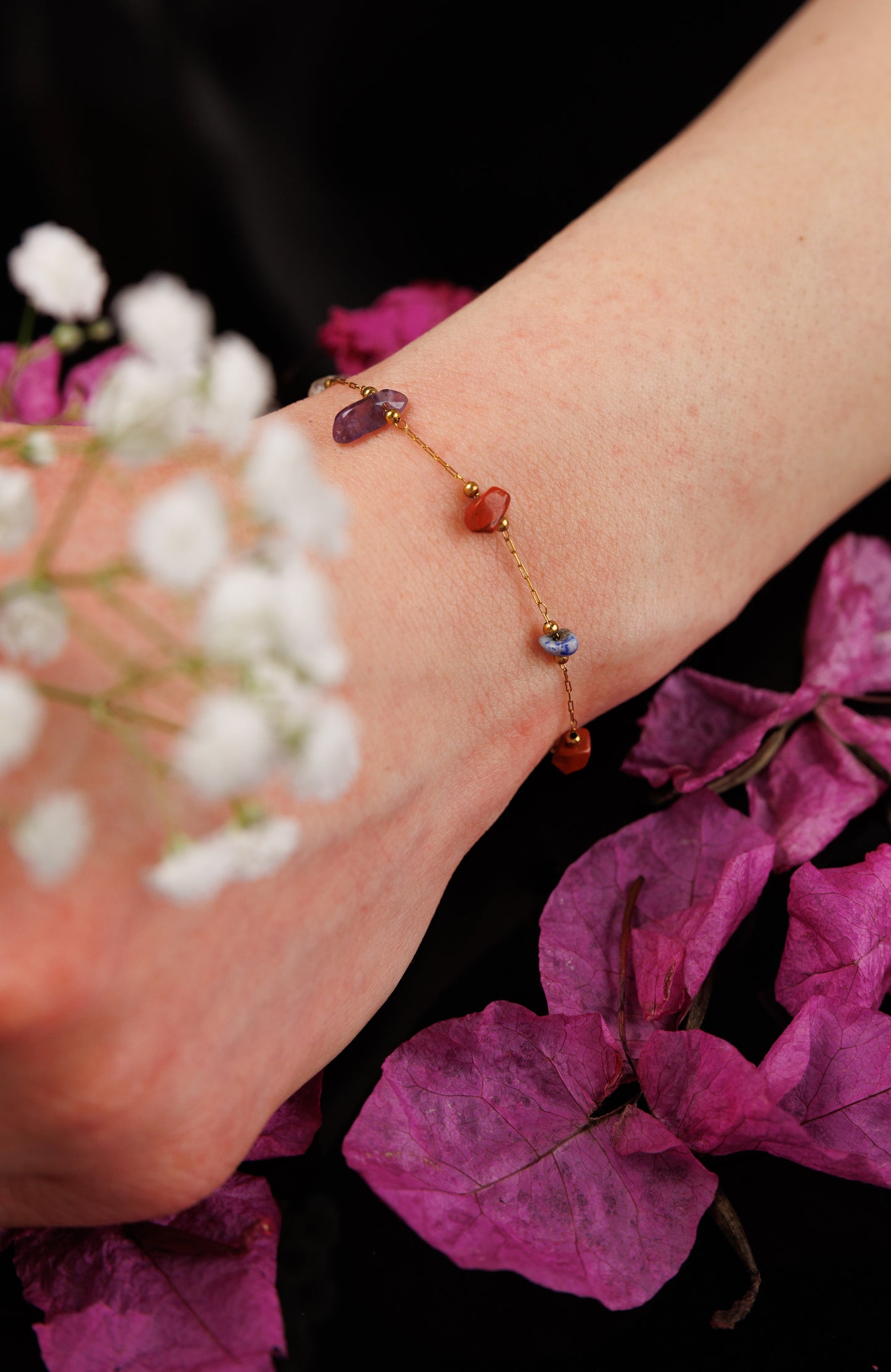 Expertly crafted with natural stone and stainless steel, this chain bracelet.