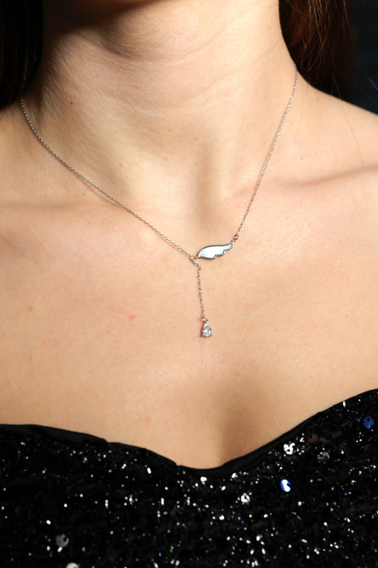 Necklace with seashell wing and zircon in the bottom