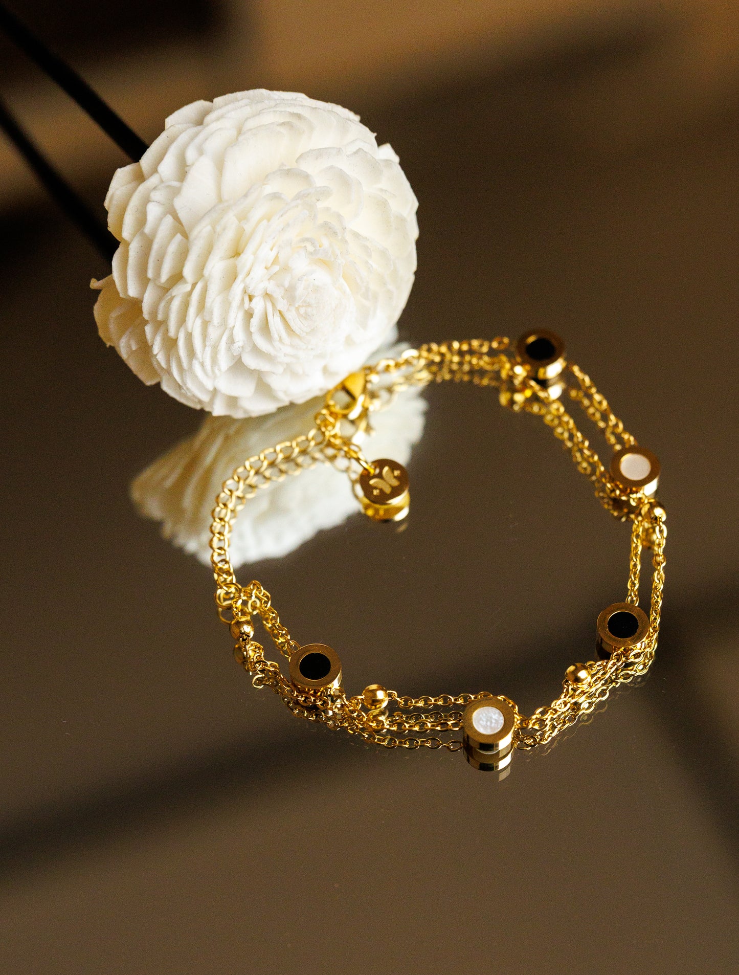Romantic French double layer bracelet. Made with high-quality stainless steel and a coloured shell, this waterproof jewelry piece exudes elegance and durability.